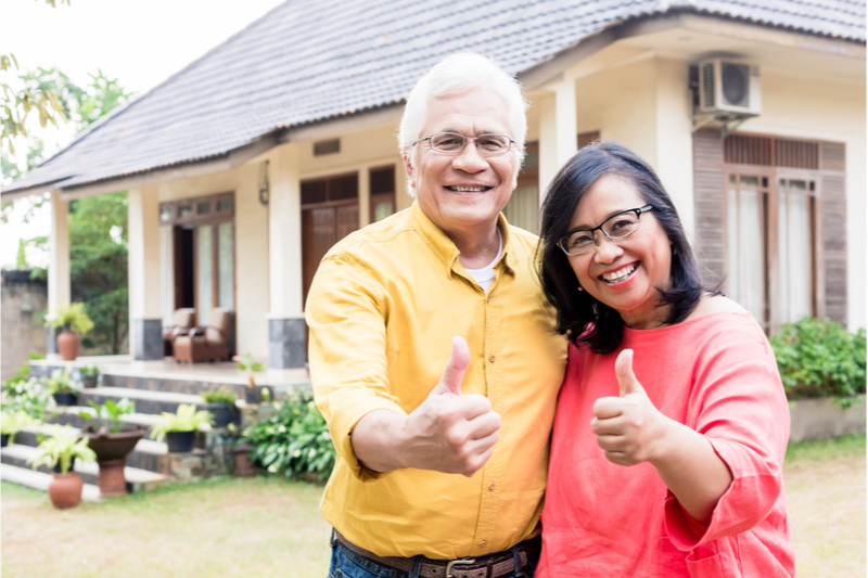 Senior couple outside home